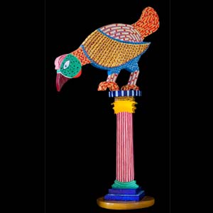 lof der zotheideen gekleurd beeld van een korintische zuil met daarop een grote vogel
